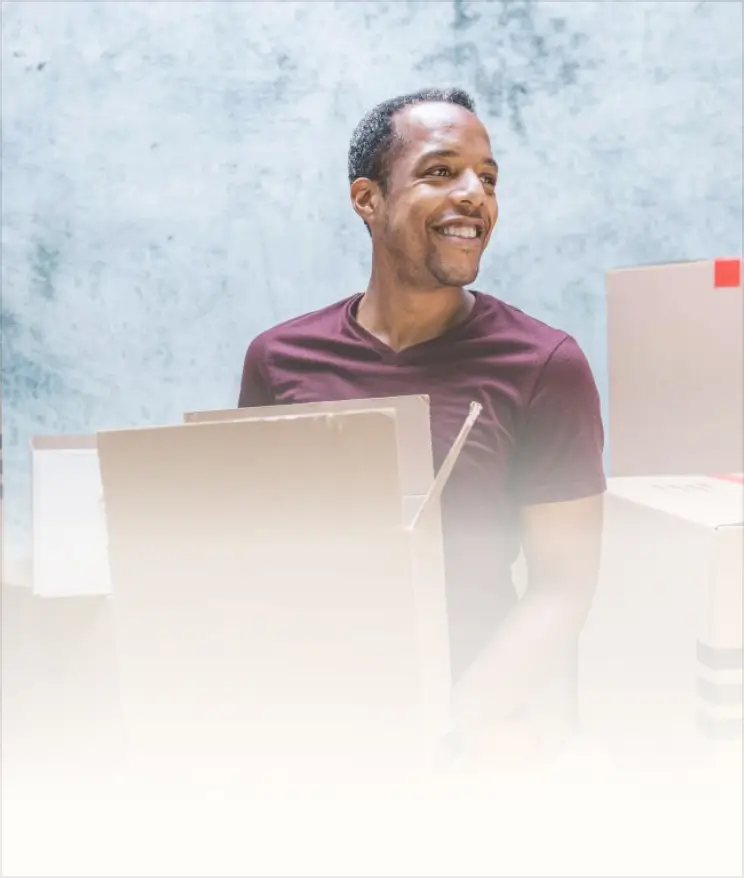 A man sitting in front of a laptop computer