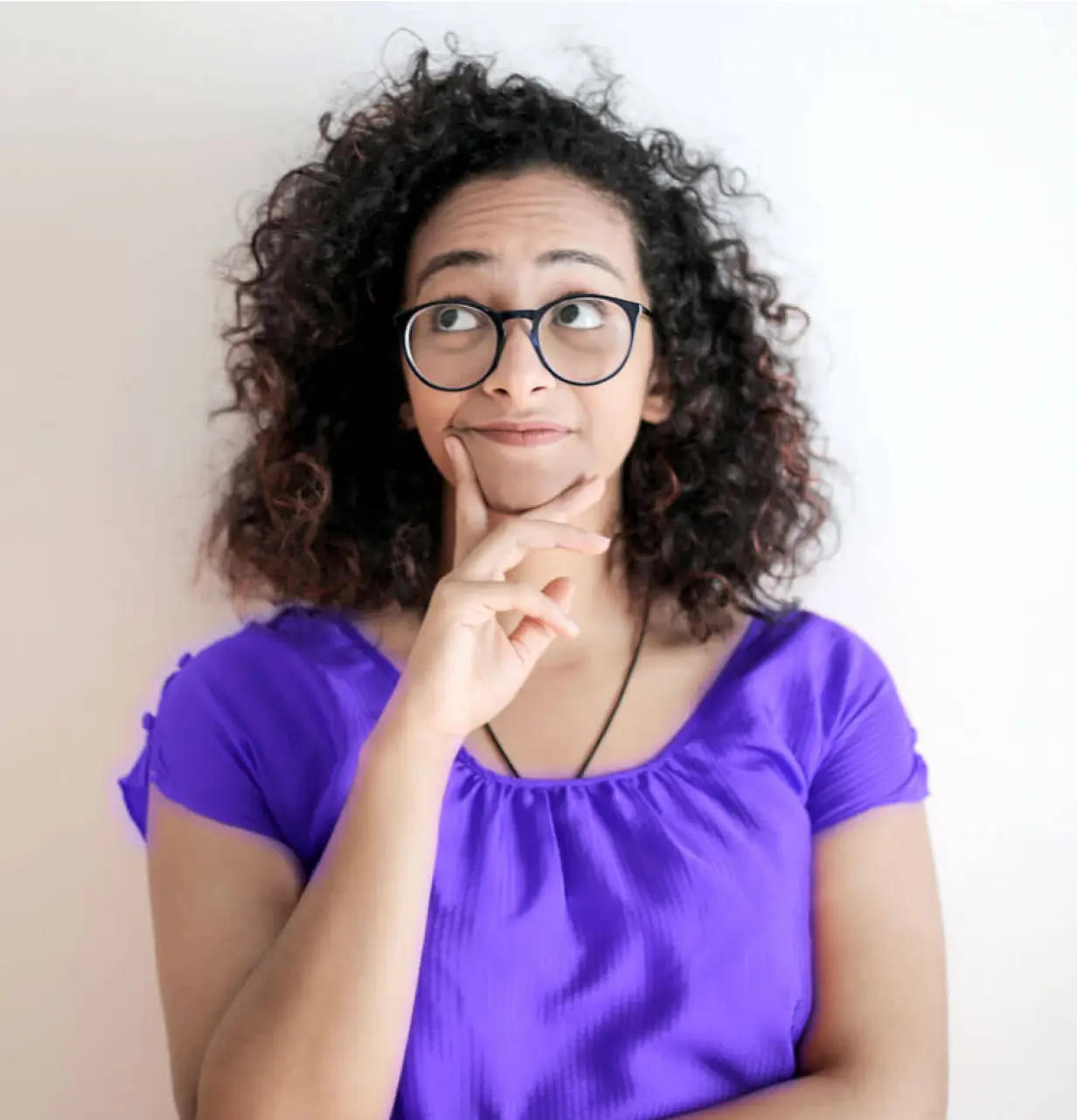 A woman wearing glasses and a purple shirt